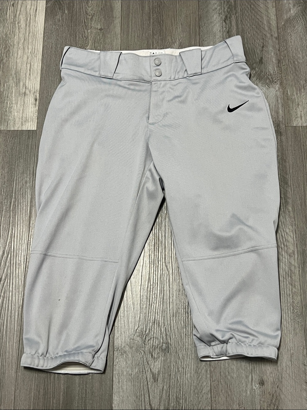 Nike woman’s softball pants / grey / size L